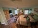 Spacious bedroom features a ceiling fan and a cozy seating area at 18027 Baywood Forest Dr, Hudson, FL 34667