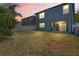 Large backyard with a fence, offering ample space for outdoor activities at 18061 Glastonbury Ln, Land O Lakes, FL 34638