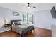 Calm bedroom featuring hardwood floors, a ceiling fan, and a serene atmosphere at 18061 Glastonbury Ln, Land O Lakes, FL 34638