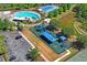 Aerial view of the community pool, playground, and tennis courts at 18061 Glastonbury Ln, Land O Lakes, FL 34638