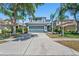 Charming two-story home featuring a well-maintained lawn and a spacious two car garage at 18061 Glastonbury Ln, Land O Lakes, FL 34638