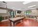 Community game room featuring a pool table, comfortable seating, and ample lighting at 18061 Glastonbury Ln, Land O Lakes, FL 34638