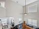 Elevated view of the bright living room and open floorplan featuring a staircase and lots of natural light at 18061 Glastonbury Ln, Land O Lakes, FL 34638