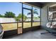 Enclosed patio with views of the backyard and surrounding landscape, perfect for relaxing at 18061 Glastonbury Ln, Land O Lakes, FL 34638