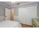 Charming bedroom with a large closet, beadboard paneling, and soft lighting at 1810 Winsloe Dr, Trinity, FL 34655
