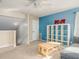 Bonus room with carpet flooring, a ceiling fan, and stairs at 1810 Winsloe Dr, Trinity, FL 34655