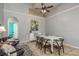 Comfortable dining area complemented by neutral walls, unique artwork and decorative light fixture at 1810 Winsloe Dr, Trinity, FL 34655