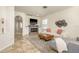 Bright living room with tiled floors, fireplace, and a comfortable couch, perfect for entertaining guests at 1810 Winsloe Dr, Trinity, FL 34655