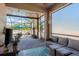Enjoy the view from this screened patio with seating and outdoor decor at 1810 Winsloe Dr, Trinity, FL 34655