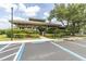 Community pavilion featuring accessible parking, hedges, and well-maintained landscaping at 1810 Winsloe Dr, Trinity, FL 34655