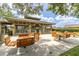 Community picnic pavilion featuring seating with picnic tables and mature shade trees at 1810 Winsloe Dr, Trinity, FL 34655