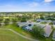 Lovely aerial view of a vibrant residential community with well-maintained homes and lush green landscaping at 18209 Breland Dr, Hudson, FL 34667