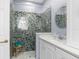 Bathroom with glass enclosed shower, vanity, and modern fixtures at 18209 Breland Dr, Hudson, FL 34667