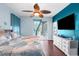 Inviting bedroom with ceiling fan and sliding door access to the lanai at 18209 Breland Dr, Hudson, FL 34667
