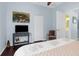 Bright bedroom with a wall-mounted television, closet, and easy access to the bathroom at 18209 Breland Dr, Hudson, FL 34667