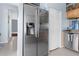 Kitchen featuring stainless steel appliances, tile flooring, with views into other rooms, and ample cabinet space at 18209 Breland Dr, Hudson, FL 34667