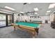 Spacious billiards room with well-maintained pool tables and comfortable seating at 18532 Myrtlewood Dr, Hudson, FL 34667