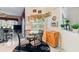 Cozy dining area with a glass table, decorative lighting, and large window at 18532 Myrtlewood Dr, Hudson, FL 34667