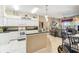 Bright kitchen featuring white cabinets, green countertops and stainless-steel appliances at 18532 Myrtlewood Dr, Hudson, FL 34667