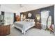 Charming main bedroom with dark accent wall and warm lighting at 18532 Myrtlewood Dr, Hudson, FL 34667