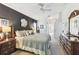 Spacious main bedroom with dark accent wall and warm lighting at 18532 Myrtlewood Dr, Hudson, FL 34667
