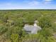 Secluded home surrounded by lush greenery offering privacy and a serene setting at 18620 Gracie Lee St, Spring Hill, FL 34610