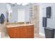 Elegant bathroom detail with vanity and stone shower at 18620 Gracie Lee St, Spring Hill, FL 34610