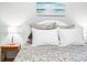 Bedroom featuring a white bed frame, hardwood floors, and a neutral color scheme at 18620 Gracie Lee St, Spring Hill, FL 34610