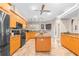 Well-equipped kitchen with a central island, granite countertops, modern appliances, and ample storage at 18620 Gracie Lee St, Spring Hill, FL 34610