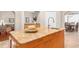 Lovely kitchen island featuring granite countertops, stainless steel fixtures and adjacent dining area at 18620 Gracie Lee St, Spring Hill, FL 34610