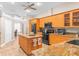 Spacious kitchen featuring granite countertops, stainless steel appliances, and wood cabinetry at 18620 Gracie Lee St, Spring Hill, FL 34610