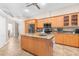 Open kitchen featuring a central island, stainless steel appliances, and abundant cabinet storage at 18620 Gracie Lee St, Spring Hill, FL 34610