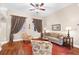 Inviting living room with comfortable seating, area rug, and natural light from draped windows at 18620 Gracie Lee St, Spring Hill, FL 34610
