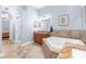 Serene main bathroom with a soaking tub, vanity, and natural light at 18620 Gracie Lee St, Spring Hill, FL 34610