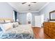 Spacious main bedroom with an ensuite entrance and warm wood floors at 18620 Gracie Lee St, Spring Hill, FL 34610