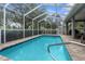 Relaxing screened-in pool with brick pavers and ample space for outdoor enjoyment at 18620 Gracie Lee St, Spring Hill, FL 34610