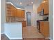 Bright kitchen features wood cabinets, granite counters, a breakfast bar and modern appliances at 19855 Ellendale Dr, Land O Lakes, FL 34638