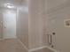 Functional laundry area with tile floors, hookups for appliances, and a wire rack shelf at 19855 Ellendale Dr, Land O Lakes, FL 34638