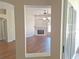 View of a cozy living room with a fireplace, laminate floors, and natural light at 19855 Ellendale Dr, Land O Lakes, FL 34638