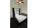 Bedroom featuring wood floors, a ceiling fan, and sliding glass doors to a private deck at 210 S Hale Ave, Tampa, FL 33609
