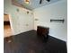 Bedroom features dark wood floors, large window with door, neutral walls, and ceiling fan at 210 S Hale Ave, Tampa, FL 33609