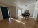 View of the dining room with tile flooring and views of the front yard at 210 S Hale Ave, Tampa, FL 33609