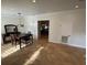 Bright dining room with a dark wood dining table, tile flooring, and an open doorway to another room at 210 S Hale Ave, Tampa, FL 33609