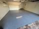 The spacious two-car garage has epoxy flooring, ample lighting, and convenient interior access at 210 S Hale Ave, Tampa, FL 33609
