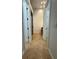Hallway with view to the walk-in shower and vanity with tile flooring at 210 S Hale Ave, Tampa, FL 33609