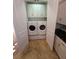 A convenient laundry room with plenty of storage and room for side-by-side washer and dryer at 210 S Hale Ave, Tampa, FL 33609