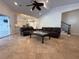 The open-concept living room boasts tile flooring, high ceilings, and abundant natural light at 210 S Hale Ave, Tampa, FL 33609