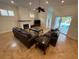 The cozy living room features tile flooring, a fireplace, and easy access to the screened pool at 210 S Hale Ave, Tampa, FL 33609