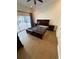 Empty main bedroom with ensuite bath and sliding glass doors to patio at 210 S Hale Ave, Tampa, FL 33609