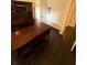 Office space features dark wood floors and built-in shelving for ample storage and a professional look at 210 S Hale Ave, Tampa, FL 33609